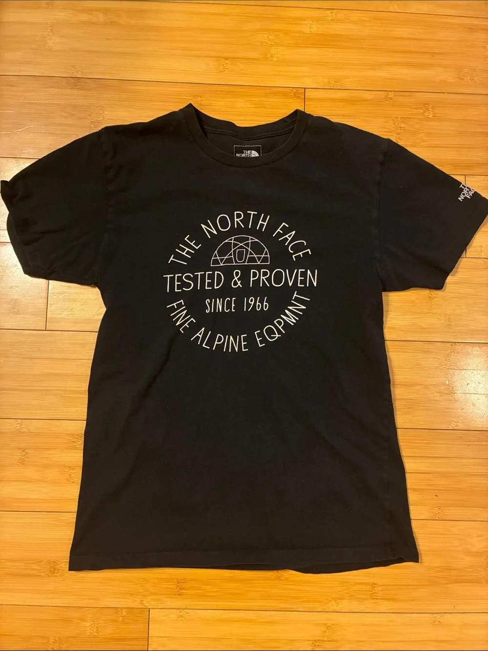 The North Face Black Tee with White Circular Logo